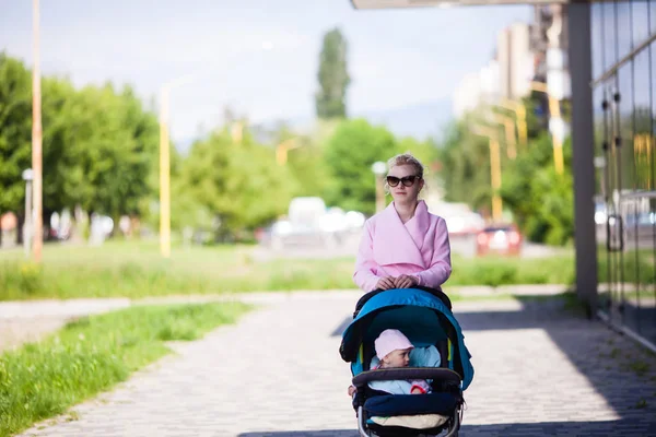 Fashionable mom with baby — Stock Photo, Image