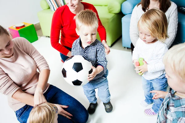 Children stretch to the ball — Stock Photo, Image