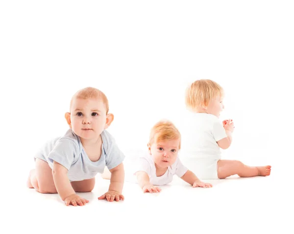 Три изолированных младенца — стоковое фото