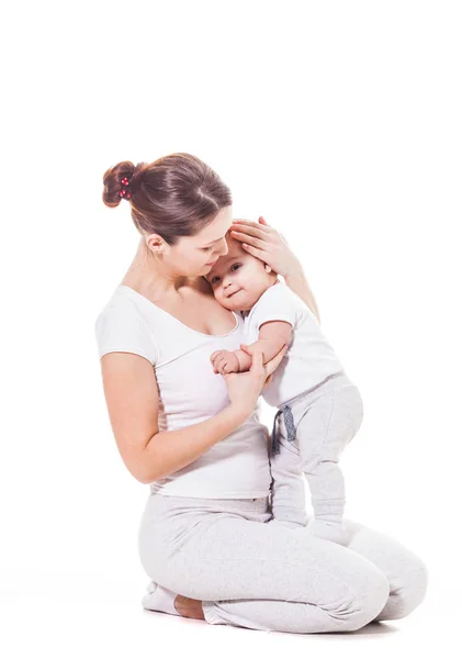Mother hugs baby boy — Stock Photo, Image