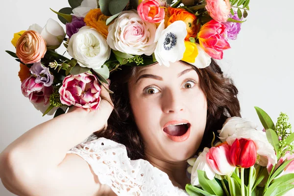 Inspired woman with flowers — Stock Photo, Image