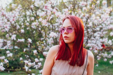 Young woman with pink hair and sensual look