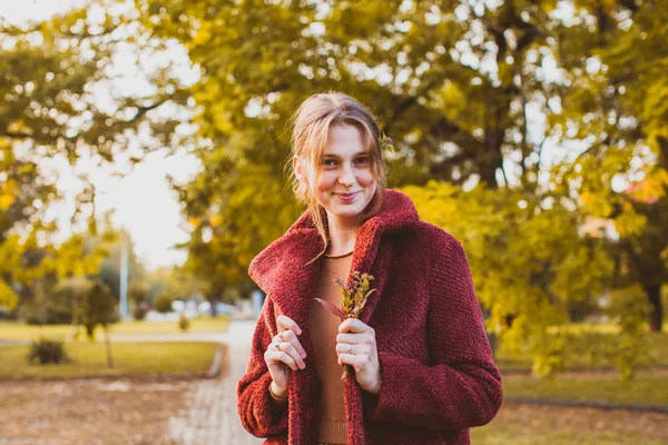 Portrait of girl in a burgundy coat — Stok fotoğraf