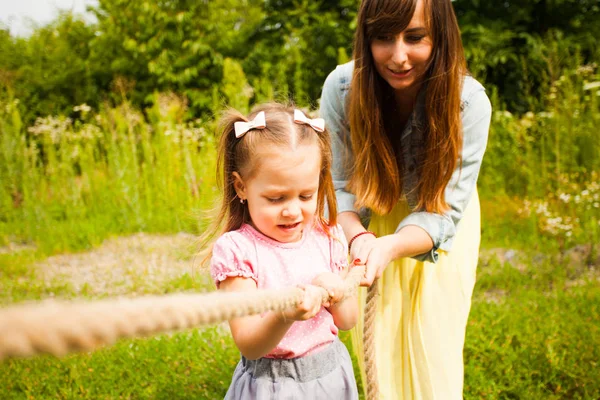 Happy mother and daughter having fun together on nature — 스톡 사진
