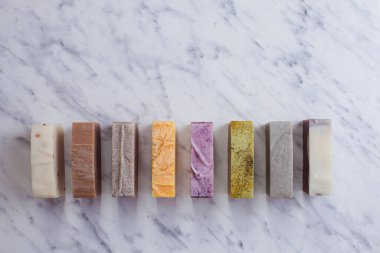 Different handmade soap bars, flat lay, top view. Eco soap and cosmetics. Natural healthy product.