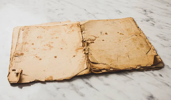 Opened vintage book on marble table with blank pages — Stock Photo, Image