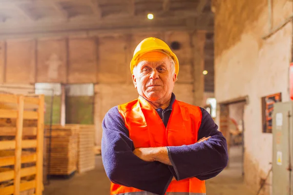 Self confident professional worker in a robe and helmet — 스톡 사진