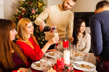company of young friends celebrating new year