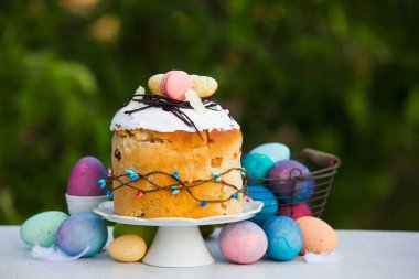 Decorated Easter braed with painted eggs, outdoors