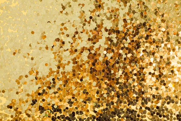 Gold glitter texture. Celebratory background. Golden explosion of confetti. — ストック写真