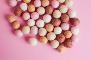 Close up felt balls in pastel colours