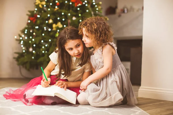 Girls sharing their dreams on Christmas eve