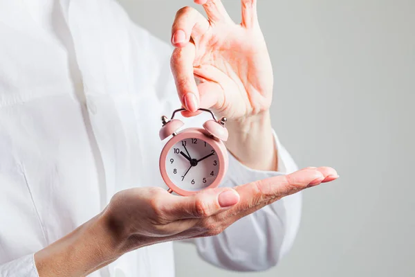 Adult woman waiting for alarm clock to sound — Stock Photo, Image