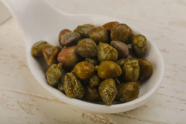 Pickled capers in the bowl — Stock Photo, Image