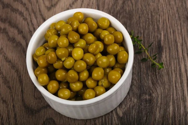 Pickled peas in the plate — Stock Photo, Image