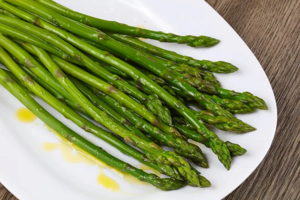 Boiled asparagus with olive oil Stock Photo