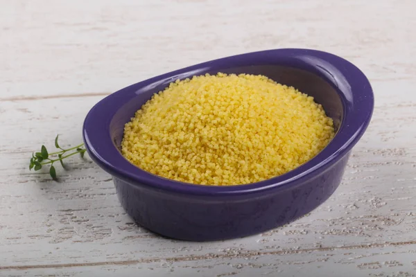 Raw couscous  in the bowl — Stock Photo, Image