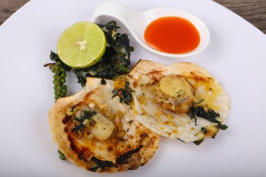 Ispanak ile pişmiş tarak