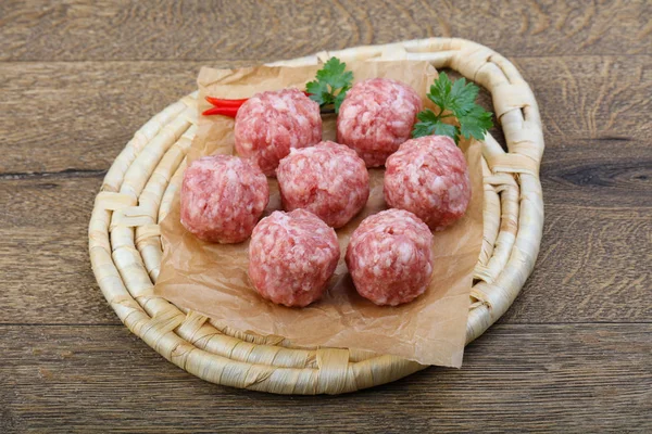 Raw meatballs with pepper — Stock Photo, Image