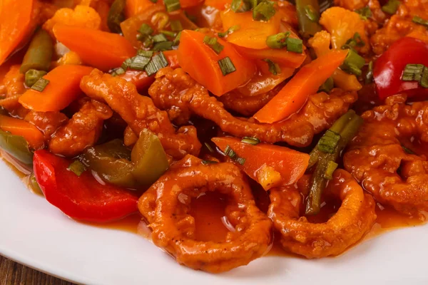 Squid rings in sweet and sour sauce — Stock Photo, Image