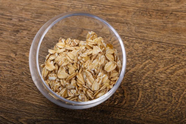 Avena cruda en el tazón —  Fotos de Stock