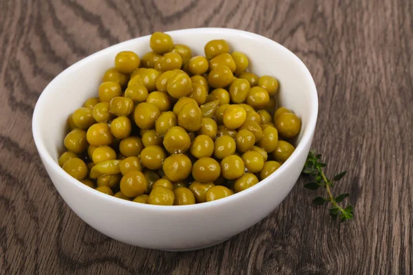 Pickled peas in the plate — Stock Photo, Image