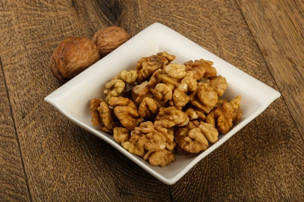 Opened walnuts  in the bowl — Stock Photo, Image