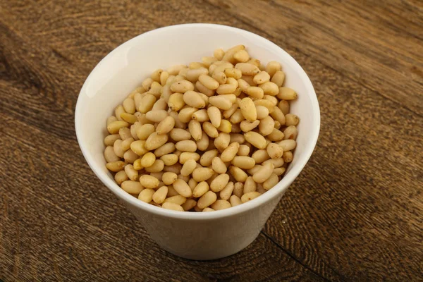 Cedar nuts in the bowl — Stock Photo, Image