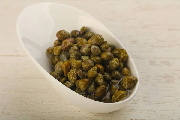 Pickled capers  in the bowl — Stock Photo, Image