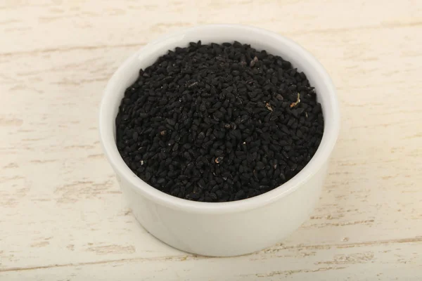 Negro nigella semillas en el tazón — Foto de Stock