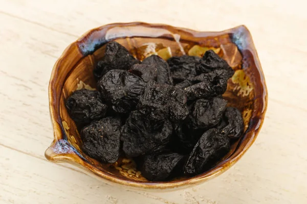 Dried plums in the bowl