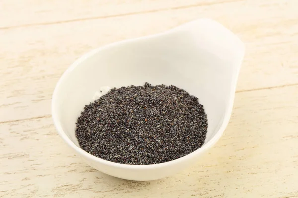 Poppy seeds in the bowl — Stock Photo, Image