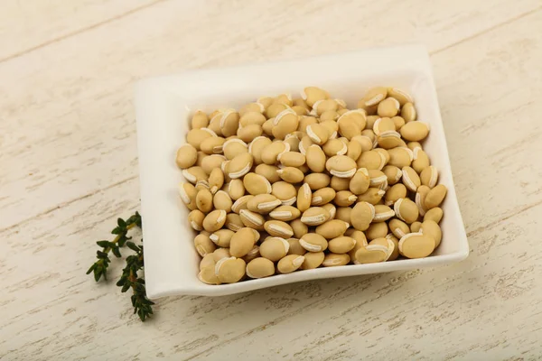 Frijoles Blancos Crudos Tazón Sobre Fondo Madera — Foto de Stock