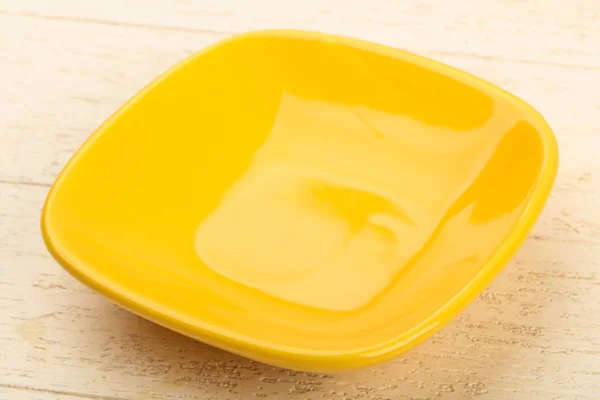 Empty yellow plate — Stock Photo, Image