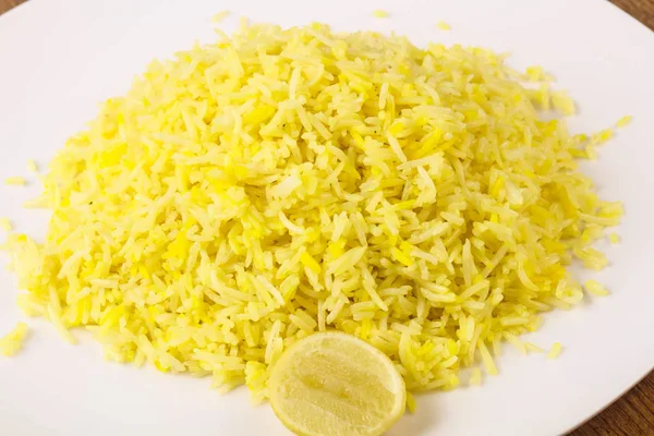 Yellow rice with lime — Stock Photo, Image