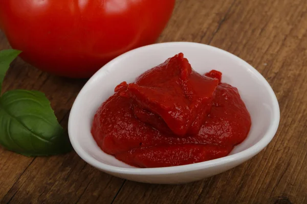 Tomato paste in the bowl — Stock Photo, Image