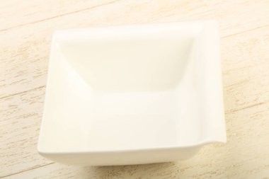 Ev ya da ahşap arka plan lokantayı için boş beyaz kase