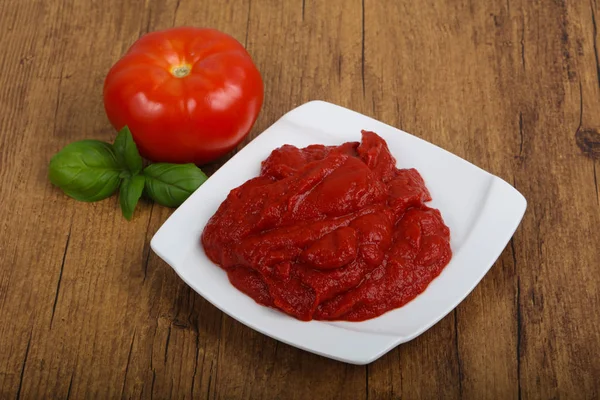 Tomato paste in the bowl — Stock Photo, Image