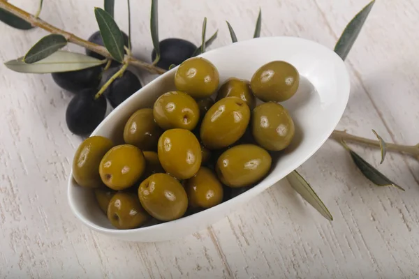 Green olives  in the bowl — Stock Photo, Image