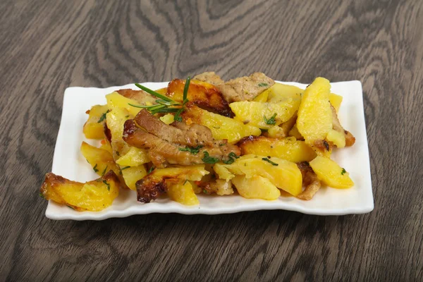 Fried potato with pork — Stock Photo, Image