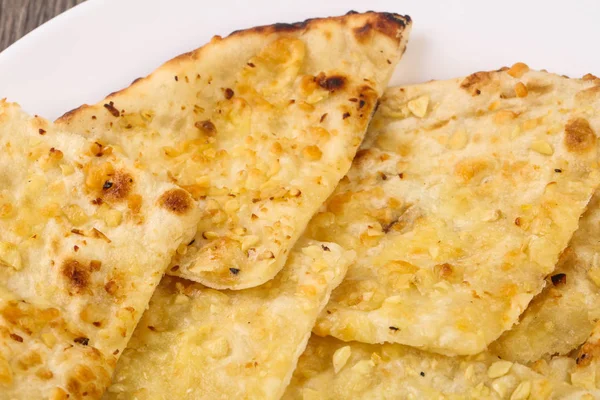 Naan with cheese and garlic — Stock Photo, Image