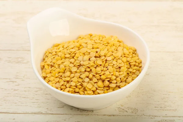 Yellow lentil in the bowl