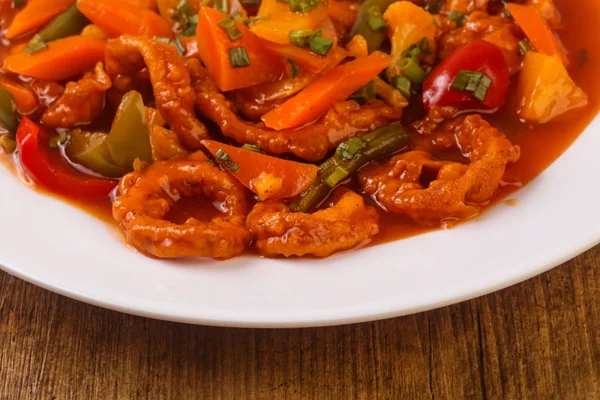 Squid rings in sweet and sour sauce — Stock Photo, Image