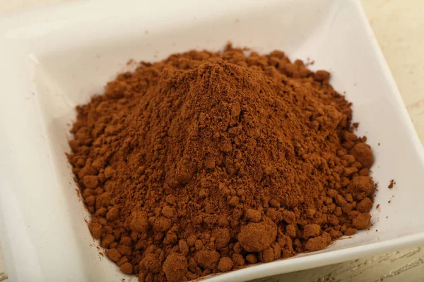 Cocoa powder in bowl — Stock Photo, Image