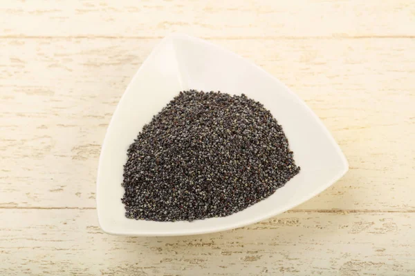 Poppy seeds in the bowl — Stock Photo, Image