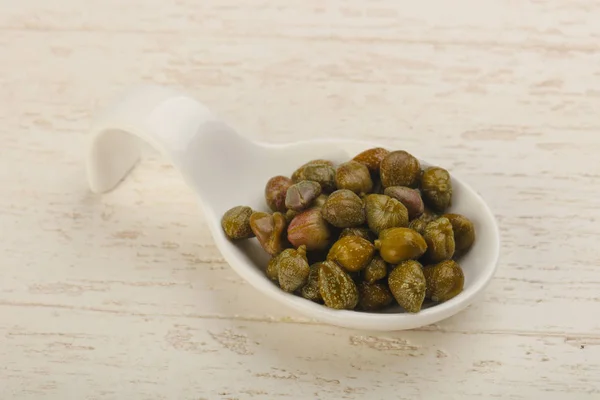 Marinated capers in the bowl — Stock Photo, Image