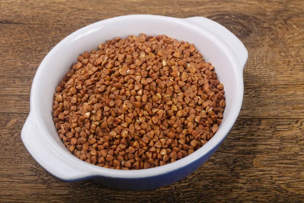 Raw buckwheat  in the bowl — Stock Photo, Image