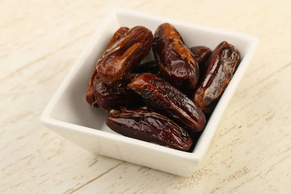 Sweet dates in the bowl — Stock Photo, Image