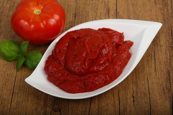 Tomato paste in the bowl — Stock Photo, Image