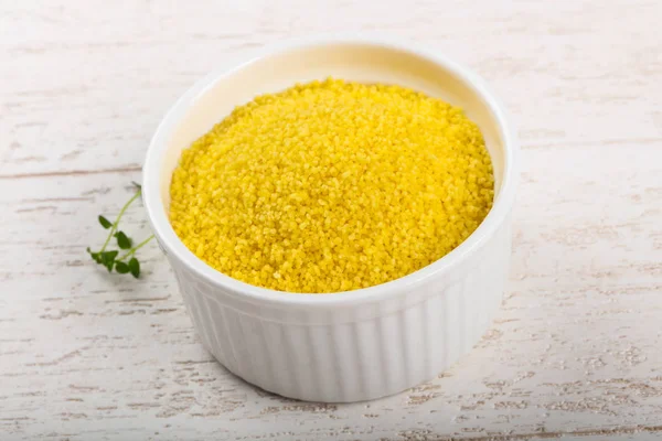 Raw couscous in the bowl — Stock Photo, Image